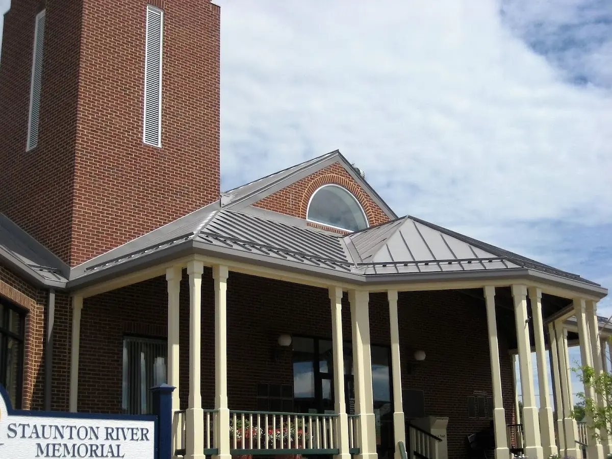 Skilled roofing craftsmen working on a residential roof in Haw River